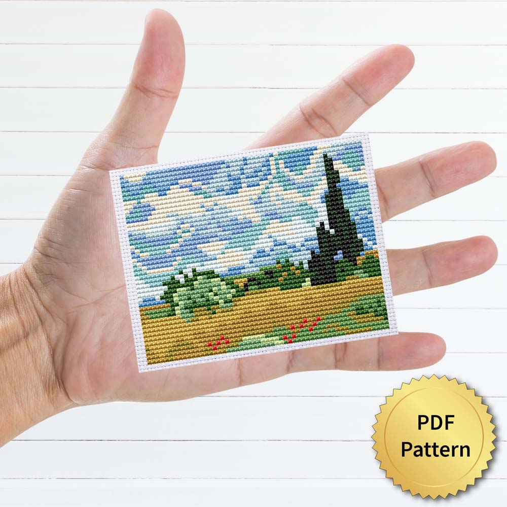 Wheat Field with Cypresses cross stitch pattern featuring a beautiful reproduction of the famous Vincent van Gogh painting