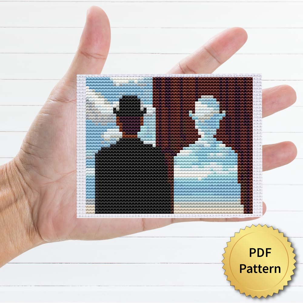 Decalcomania cross stitch pattern featuring a beautiful reproduction of the famous Rene Magritte