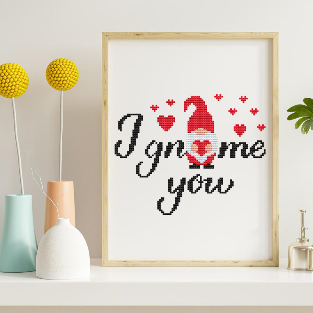 A cross stitch pattern featuring cute love gnome