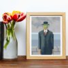 The Son of Man cross stitch pattern featuring a beautiful reproduction of the famous Rene Magritte